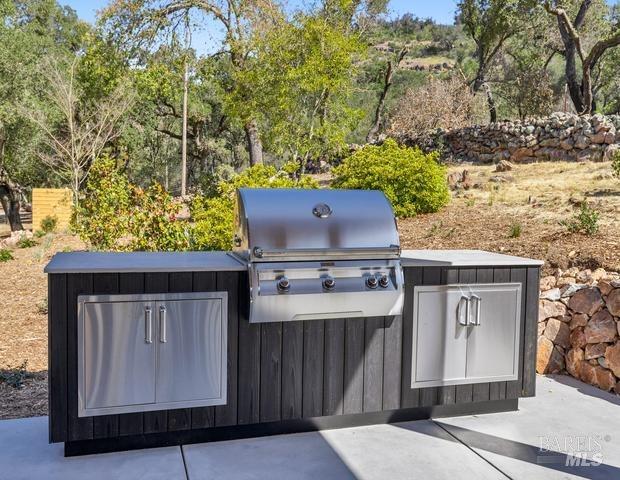 view of patio with a grill