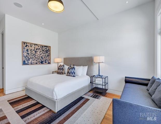 bedroom with light hardwood / wood-style floors