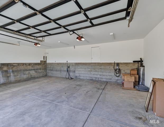 garage featuring a garage door opener