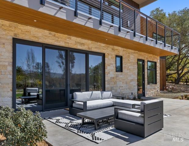 view of terrace with a balcony and an outdoor hangout area