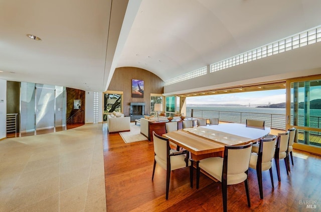 dining area with hardwood / wood-style flooring and vaulted ceiling