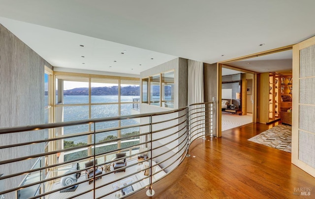 hallway featuring a mountain view and hardwood / wood-style flooring