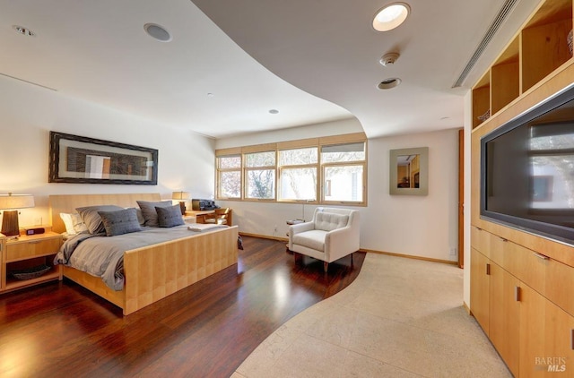 bedroom with wood-type flooring