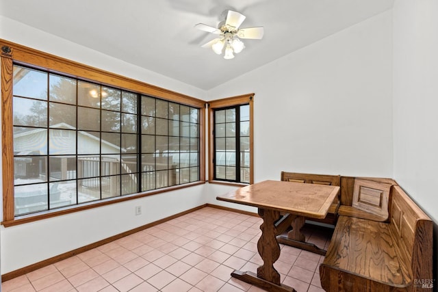 tiled office space featuring ceiling fan and vaulted ceiling