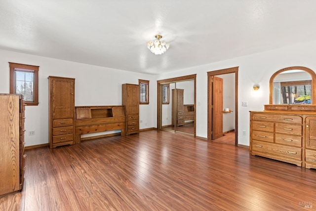 bedroom with dark wood-type flooring