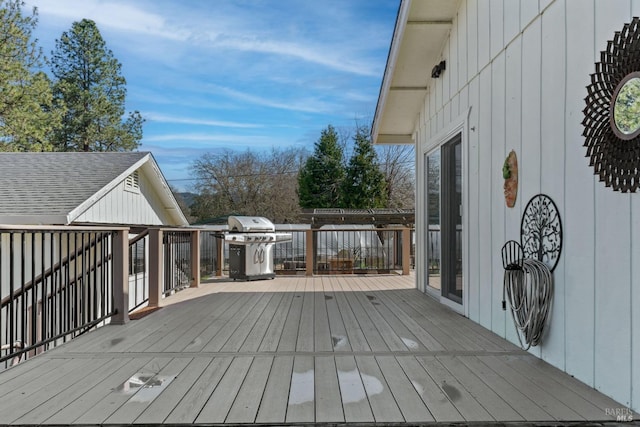 wooden terrace with area for grilling