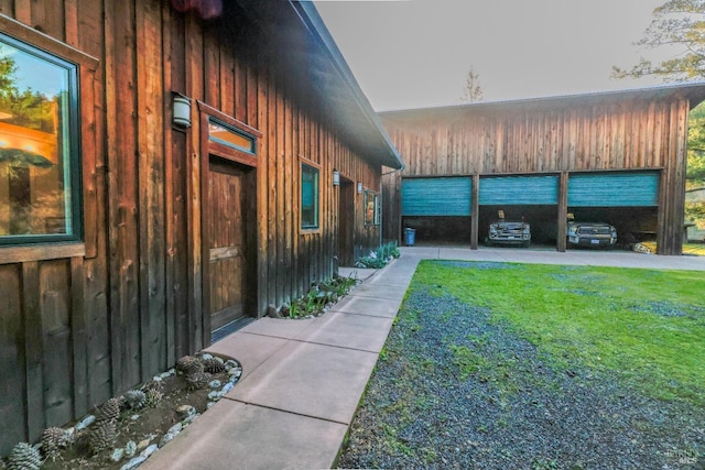 view of side of property with a lawn