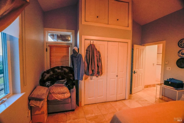 bedroom featuring a closet and light tile flooring