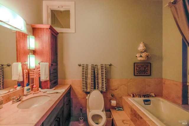 bathroom with toilet, oversized vanity, and tiled tub