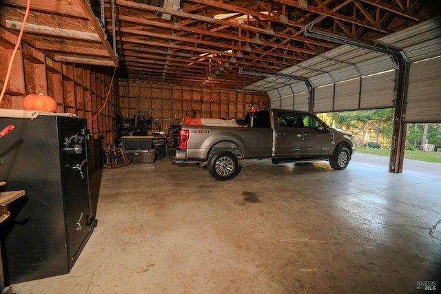 garage with black fridge