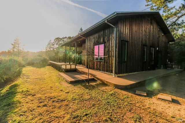 view of side of home with a patio