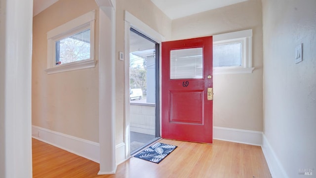 foyer entrance with light wood-type flooring