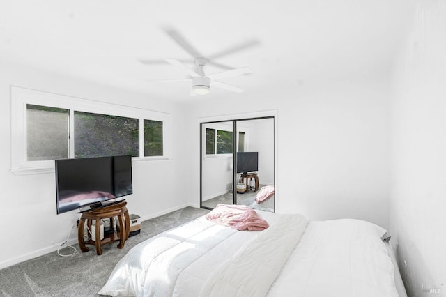 bedroom with light carpet, a closet, and ceiling fan