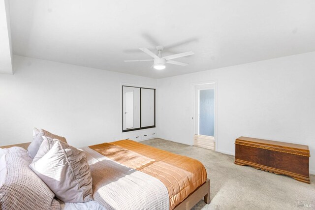 carpeted bedroom with ceiling fan