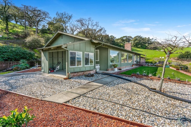 view of front of property with a front lawn and a patio area