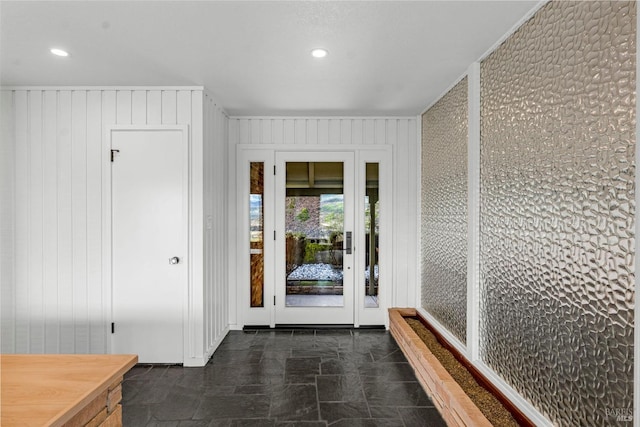 hallway featuring dark tile floors