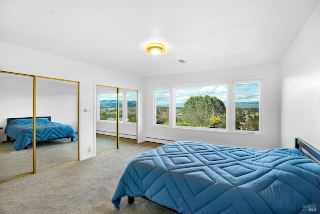 carpeted bedroom featuring two closets