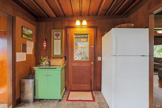 interior space featuring wooden walls and wooden ceiling