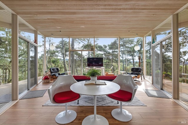 unfurnished sunroom featuring a wealth of natural light and wood ceiling