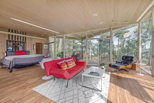 sunroom / solarium featuring wooden ceiling, a wealth of natural light, and lofted ceiling