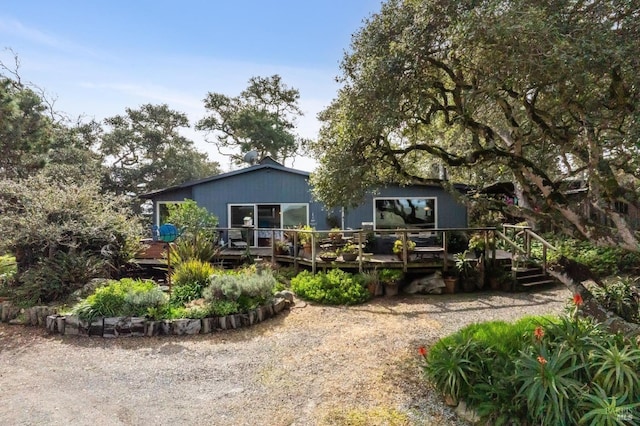 back of property featuring a deck