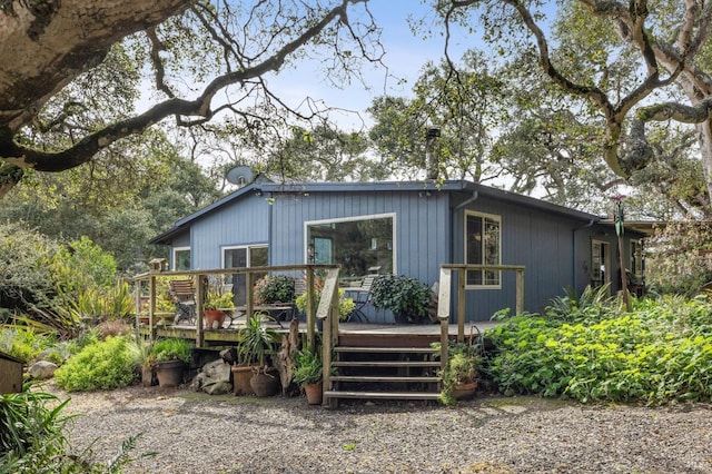 rear view of property with a wooden deck