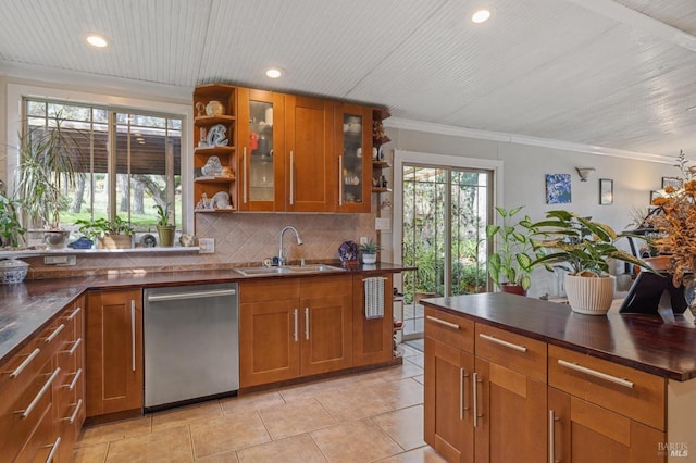 kitchen featuring dishwasher, decorative backsplash, sink, light tile patterned floors, and crown molding