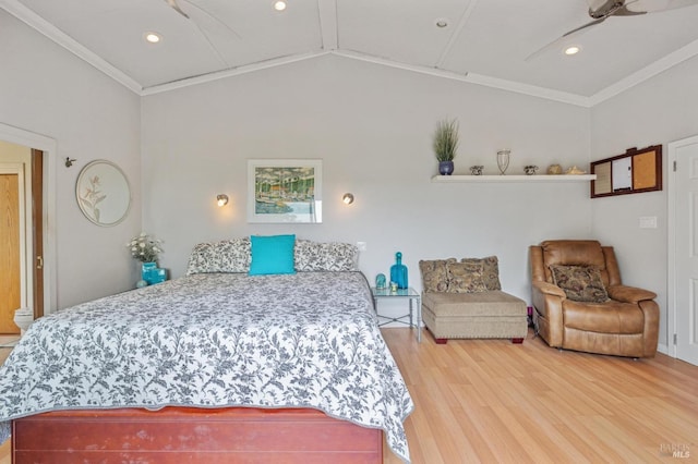 bedroom featuring wood-type flooring, vaulted ceiling, and ornamental molding