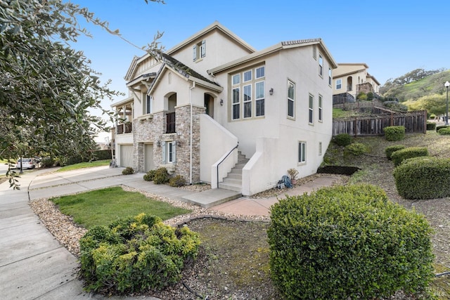 view of side of property featuring a garage