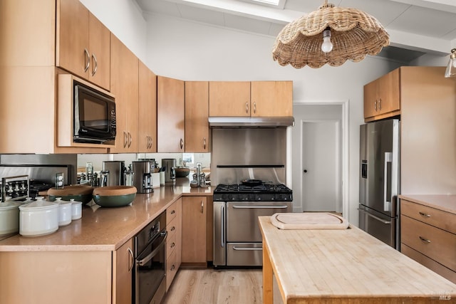 kitchen featuring light wood finished floors, wooden counters, under cabinet range hood, beam ceiling, and appliances with stainless steel finishes