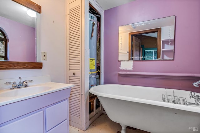 bathroom featuring a tub to relax in and vanity