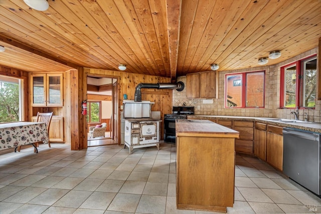 kitchen featuring wooden ceiling, black range with gas stovetop, stainless steel dishwasher, light tile patterned floors, and a kitchen island