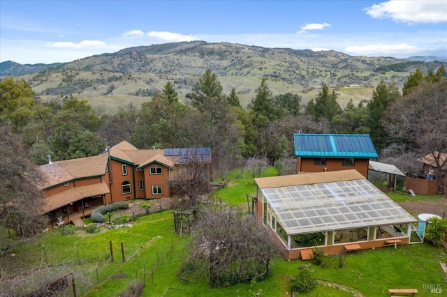 birds eye view of property with a mountain view