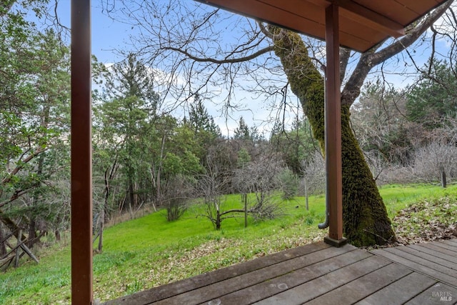 wooden deck with a yard