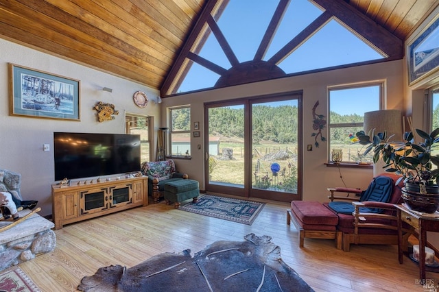 living room with wood-type flooring, wood ceiling, beam ceiling, and high vaulted ceiling