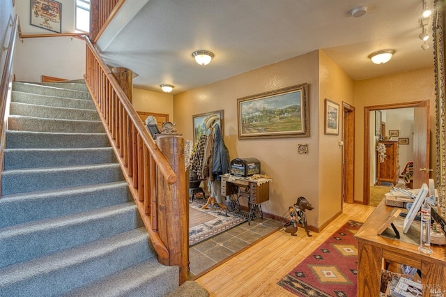 stairway with wood-type flooring