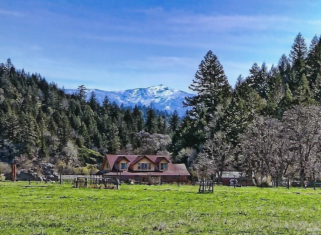 view of mountain feature with a rural view