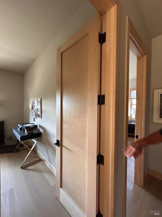 hall with light hardwood / wood-style floors