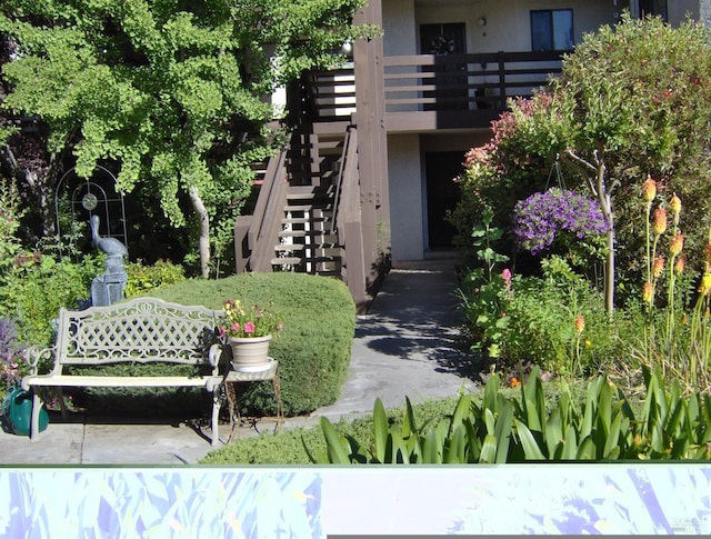 view of community featuring stairs