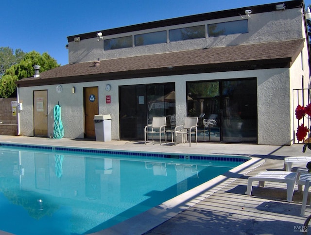 community pool with a patio