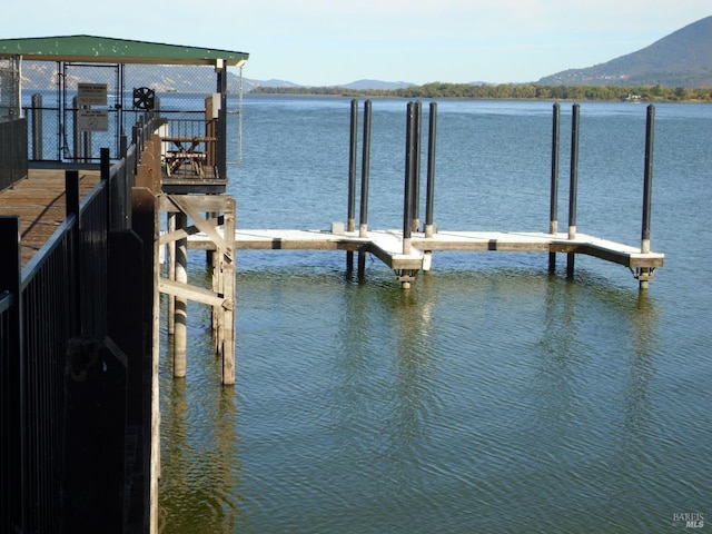 dock area featuring a water and mountain view