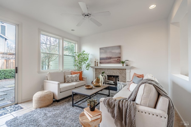 living room with ceiling fan and light tile floors