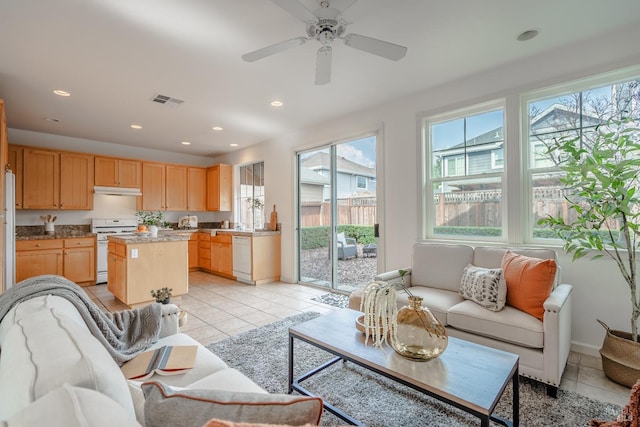 living room featuring ceiling fan and light tile floors