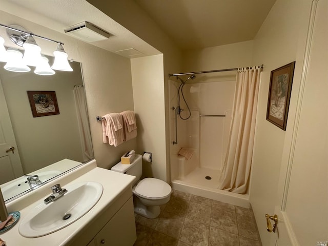 bathroom featuring a shower with shower curtain, toilet, and vanity