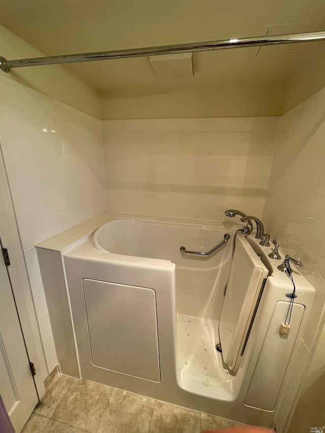 bathroom featuring a bathing tub and tile patterned floors