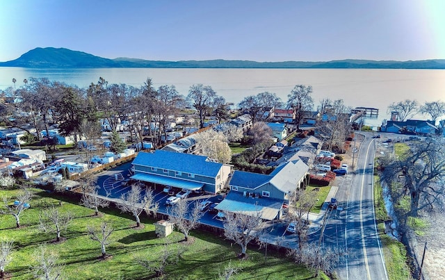 aerial view featuring a water and mountain view