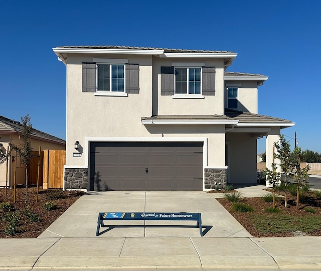 view of front of property featuring a garage