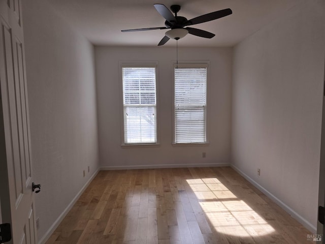 unfurnished room with ceiling fan and light hardwood / wood-style flooring