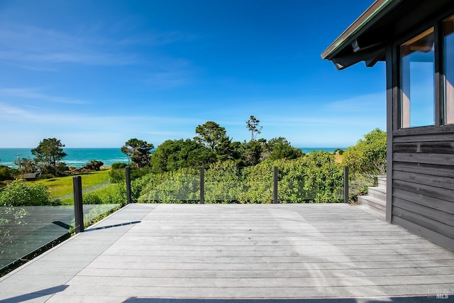 wooden deck featuring a water view