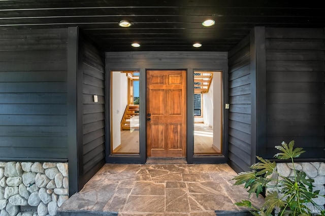 view of exterior entry featuring a porch